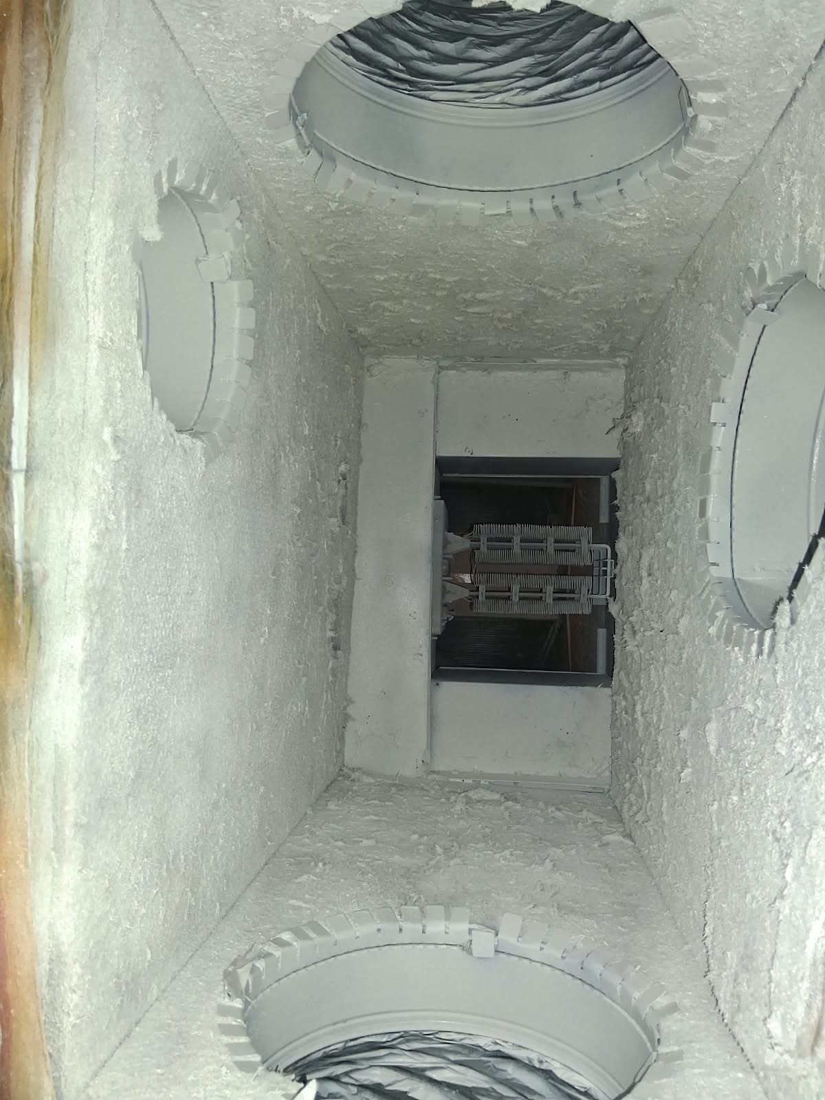 Green Air Duct Club technician cleaning ductwork on site